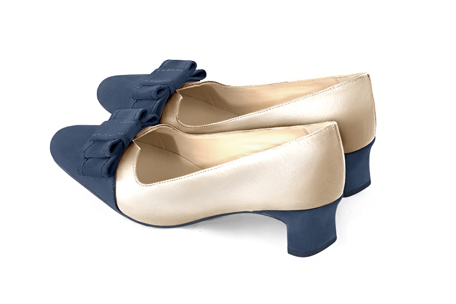 French elegance and refinement for these denim blue and gold dress pumps, with a knot on the front, 
                available in many subtle leather and colour combinations. Possibility to customize with your colors, materials and heels.
With its original cutout, this pretty fitted pump
will render you great services, combining comfort and distinction. 
                Matching clutches for parties, ceremonies and weddings.   
                You can customize these shoes to perfectly match your tastes or needs, and have a unique model.  
                Choice of leathers, colours, knots and heels. 
                Wide range of materials and shades carefully chosen.  
                Rich collection of flat, low, mid and high heels.  
                Small and large shoe sizes - Florence KOOIJMAN